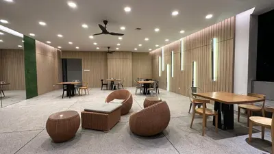 a restaurant with tables and chairs and tables and tablesktop at The Robertson Residence Bukit Bintang 20F in Kuala Lumpur