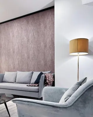 a living room with a couch and a table at Tropicana The Residence LV Suite with KLCC View in Kuala Lumpur