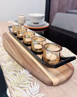 a tray of votive candles on a table at Tropicana The Residence LV Suite with KLCC View in Kuala Lumpur