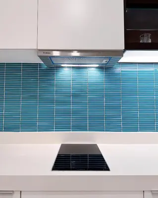 a kitchen with blue tile on the wall at Tropicana The Residence LV Suite with KLCC View in Kuala Lumpur