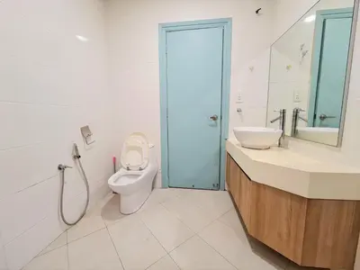 a bathroom with a toilet and a sink and a shower at Crest Residence Klcc by Sarah's Lodge in Kuala Lumpur