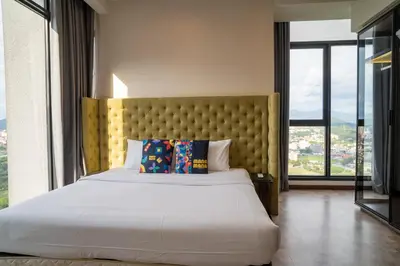 a bedroom with a large bed with a large window at EXPRESSIONZ KLCC BY MANA-MANA in Kuala Lumpur