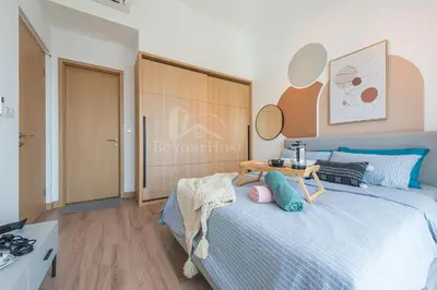 a bedroom with a bed with a table on it at The Colony by Infinitum Kuala Lumpur in Kuala Lumpur