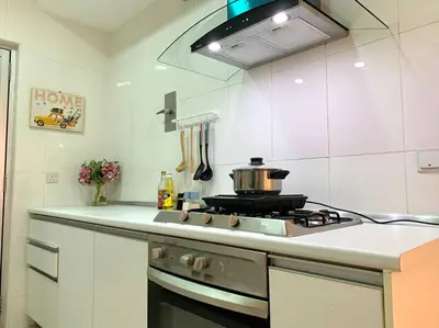 a kitchen with a stove with a pot on it at MITEC Publika 2Br Hot tub Sri Hartamas Mont Kiara in Kuala Lumpur