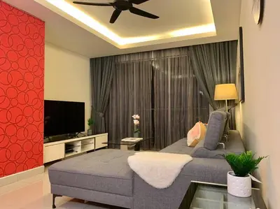 a living room with a bed and a flat screen tv at MITEC Publika 2Br Hot tub Sri Hartamas Mont Kiara in Kuala Lumpur