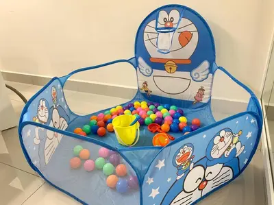 a toy chair filled with balls in a room at MITEC Publika 2Br Hot tub Sri Hartamas Mont Kiara in Kuala Lumpur