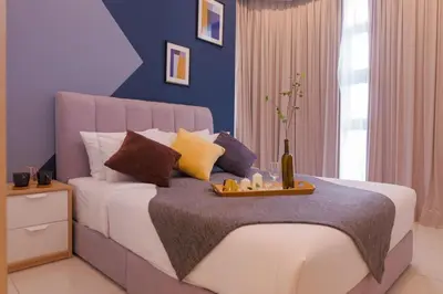 a bedroom with a bed with a tray of food on it at S31- 3 Bedroom Robertson at Bukit Bintang with Netflix in Kuala Lumpur