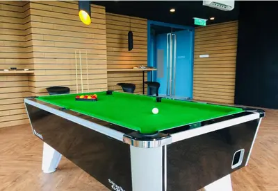 a pool table with a ball on top of it at S31- 3 Bedroom Robertson at Bukit Bintang with Netflix in Kuala Lumpur