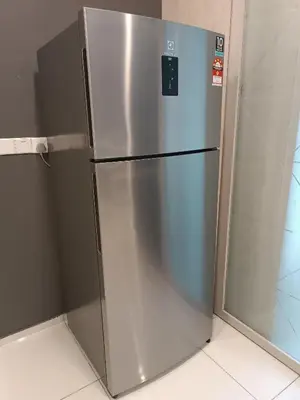 a stainless steel refrigerator sitting in a kitchen at S31- 3 Bedroom Robertson at Bukit Bintang with Netflix in Kuala Lumpur
