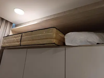 a bunk bed on a shelf in a room at S36- Robertson at Bukit Bintang 3 Bedroom with Netflix in Kuala Lumpur