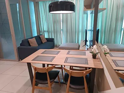 a living room with a table and chairs and a couch at S37- Bukit Bintang 3 Bedroom Suite with Netflix Robertson in Kuala Lumpur