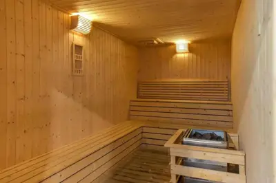 a wooden sauna with a bench in the middle at S37- Bukit Bintang 3 Bedroom Suite with Netflix Robertson in Kuala Lumpur