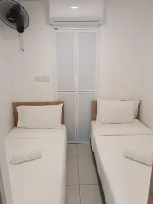 two beds in a room with a window at S37- Bukit Bintang 3 Bedroom Suite with Netflix Robertson in Kuala Lumpur