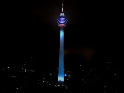 a view of the oriental pearl tower lit up at night at Luxury 2BR Home in Vortex Stunning KL Tower View Free WiFi in Kuala Lumpur