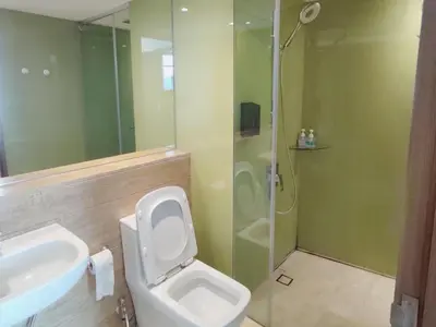 a bathroom with a toilet and a sink and a shower at Luxury 2BR Home in Vortex Stunning KL Tower View Free WiFi in Kuala Lumpur