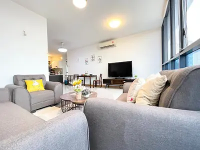 a living room with two couches and a tv at KL Gateway 2B2B Cozy apartment in Kuala Lumpur