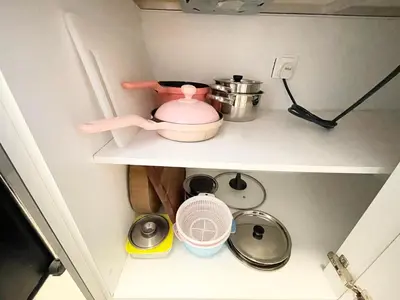 a pink tea pot on a shelf in a kitchen at KL Gateway 2B2B Cozy apartment in Kuala Lumpur