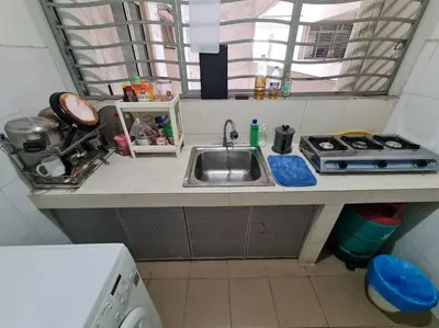 a small kitchen with a sink and a stove at 1 min Next to LRT CHERAS 68 in Kuala Lumpur