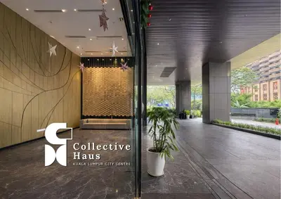 a lobby of a building with a sign that says collective has at Tropicana Residence Kuala Lumpur by Collective Haus in Kuala Lumpur