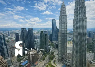 a view of the kuala lumpur city skyline with the petronas towers at Tropicana Residence Kuala Lumpur by Collective Haus in Kuala Lumpur