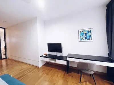 a room with a desk with a television and a chair at PROMO CONNECTED TRAIN 1 Bedroom ABOVE MALL - 5 in Kuala Lumpur