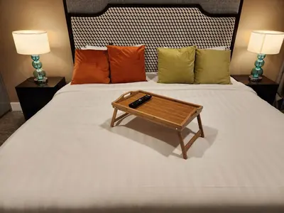 a bed with a wooden coffee table on it at The Platinum 2 by MiuKy KLCC, Kuala Lumpur in Kuala Lumpur