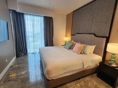 a bedroom with a large bed with a large window at The Platinum 2 by MiuKy KLCC, Kuala Lumpur in Kuala Lumpur
