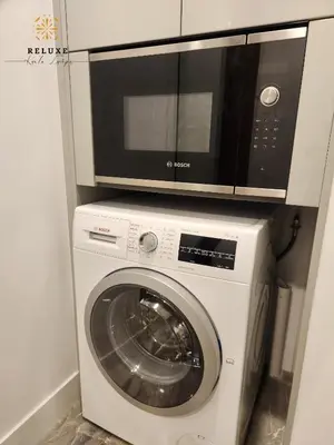 a microwave on top of a washing machine at The Platinum 2 by MiuKy KLCC, Kuala Lumpur in Kuala Lumpur