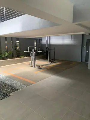 an empty parking lot with tables in a building at Neu suites 007- 2 bedrooms klcc in Kuala Lumpur