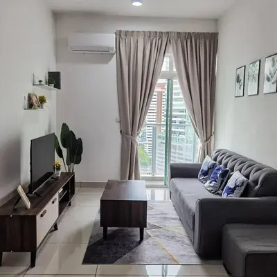 a living room with a couch and a tv at Titiwangsa 6PX near monorail PWTC Infinity pool in Kuala Lumpur