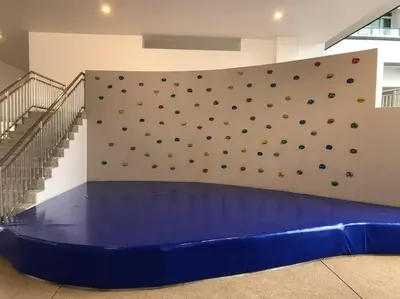 a wall with a climbing wall in a gym at Titiwangsa 6PX near monorail PWTC Infinity pool in Kuala Lumpur