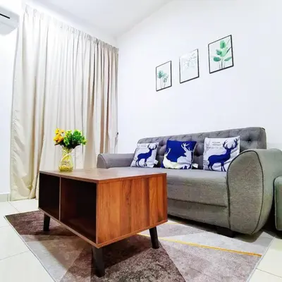 a living room with a couch and a coffee table at Titiwangsa 6PX near monorail PWTC Infinity pool in Kuala Lumpur