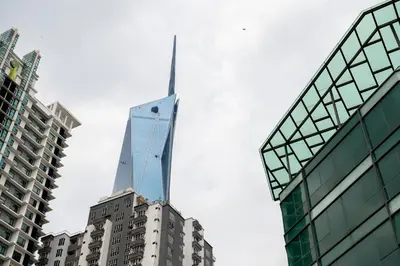 a tall skyscraper on top of a building in a city at Chill Suites Kuala Lumpur in Kuala Lumpur