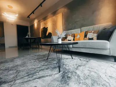 a living room with a couch and a table at Stylish KL Suite, KLCC View, Next to LRT, Datum Jelatek By Atlantis Management in Kuala Lumpur