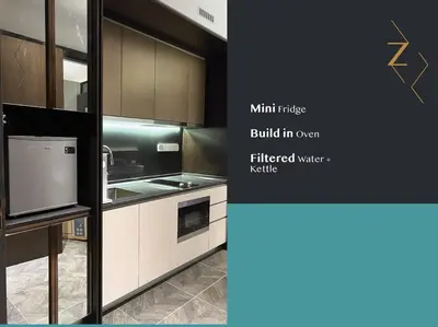 a kitchen with a refrigerator and a microwave at Scarletz Suites • KLCC • King Bed (R) in Kuala Lumpur