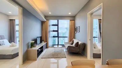 a bedroom with a bed and a chair and a television at Skyline view in Bukit Bintang The Robertson 42f in Kuala Lumpur