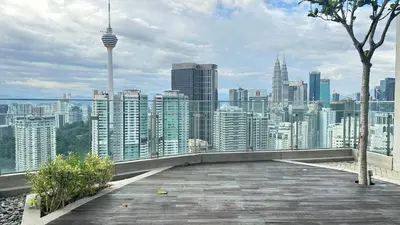 a view of a city skyline from a building at Skyline view in Bukit Bintang The Robertson 42f in Kuala Lumpur