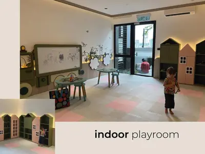 a child standing in a room with a playroom at Scarletz Suites • KLCC • King Bed (L) in Kuala Lumpur