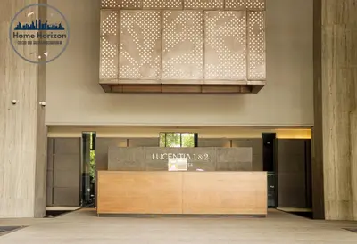 a lobby with a reception desk in a building at Lucentia Residence By Home Horizon in Kuala Lumpur