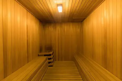 a wooden sauna with wooden floors and a light at Bukit Bintang Signatures Pavilion Kuala Lumpur in Kuala Lumpur