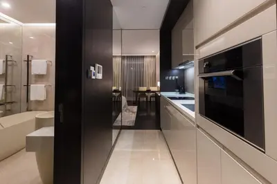a large kitchen with a sink and a microwave at Bukit Bintang Signatures Pavilion Kuala Lumpur in Kuala Lumpur