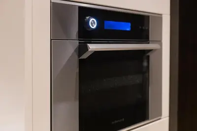 a microwave oven with a blue screen on it at Bukit Bintang Signatures Pavilion Kuala Lumpur in Kuala Lumpur