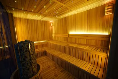 an empty wooden sauna with lights in it at Opus KL Residences by Premium Hospitality in Kuala Lumpur