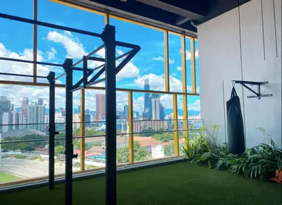 a gym with a view of the city at Opus KL Residences by Premium Hospitality in Kuala Lumpur