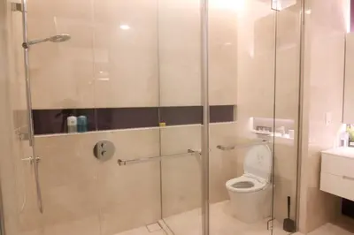 a bathroom with a shower and a toilet at Tropicana The Residences KLCC, Premium in Kuala Lumpur