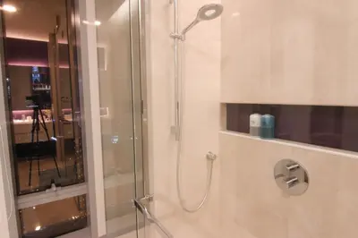 a shower with a glass door in a bathroom at Tropicana The Residences KLCC, Premium in Kuala Lumpur