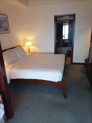 a bedroom with a large bed in a room at TM SUITE at BERJAYA TIME SQUARE KL in Kuala Lumpur