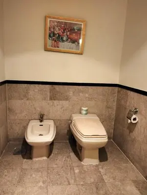 a bathroom with a toilet and a bidet at TM SUITE at BERJAYA TIME SQUARE KL in Kuala Lumpur