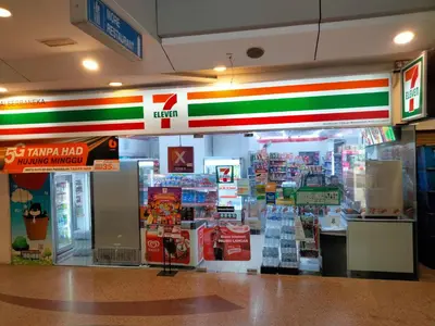 a store front of a grocery store with colorful signs at Bangsar Trade Center Studio 4pax I HomeBrickz in Kuala Lumpur