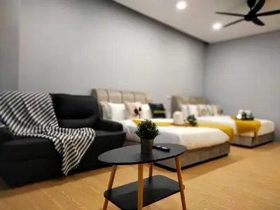 a living room with a couch and a bed at Bangsar Trade Center Studio 4pax I HomeBrickz in Kuala Lumpur